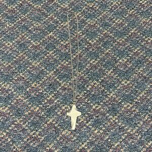 By j rauscher silver colored cross necklace